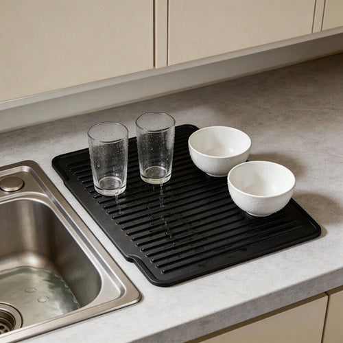 Black silicone drying mat with glasses and bowls