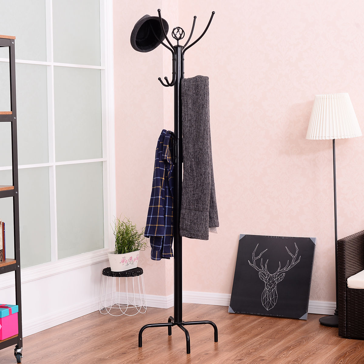 Black metal coat rack with 12 hooks in an entryway